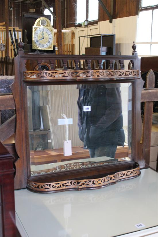 Mahogany-framed overmantel mirror fitted fret-carved serpentine shelves